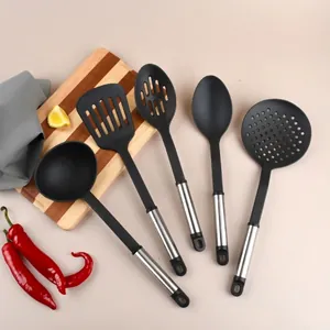 5-piece nylon kitchen utensil set with stainless steel handles on cutting board