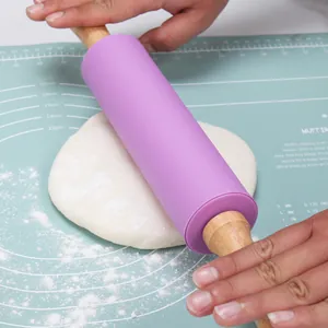 Ergonomic purple silicone rolling pin with natural wooden handles for baking pastry dough