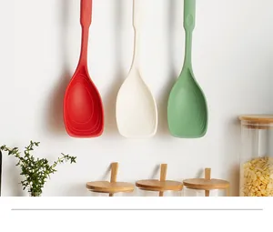 Trois spatules cuillères 2-en-1 en silicone résistantes à la chaleur suspendues.