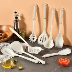 Cream semi-transparent silicone kitchen utensil set with ergonomic plastic handles.