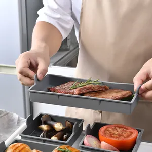Heat-resistant grey silicone baking tray set with food presentation in kitchen