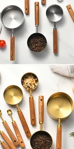 Close-up of stainless steel measuring cups and spoons with wooden handles set
