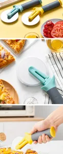Stainless steel pizza wheel cutter detail with standable ergonomic handle and guard