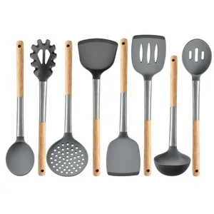 Grey silicone kitchen utensil set with wooden handles and stainless steel connectors.