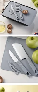 Close-up of portable grey folding cutting board and camping knife set with protective sheaths.