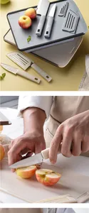 Detail of portable folding cutting board and camping knife set for outdoor use.