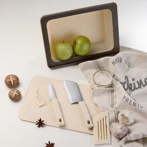 Portable camping kitchen set with foldable basket, cutting board and knives in cream finish