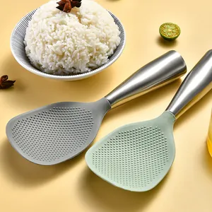 Professional non-stick silicone rice paddle with stainless steel handle on warm background