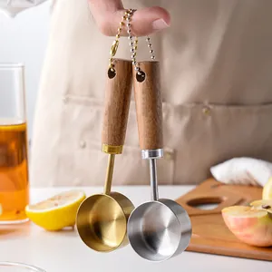 14ml wooden handle measuring spoons set in gold and silver for precise kitchen baking