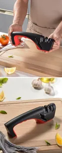 Close-up detail of a professional 3-stage manual knife sharpener on wooden board