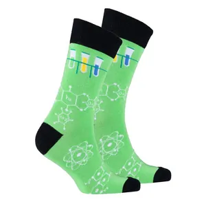 Close-up detail of green science crew socks with chemistry and physics patterns