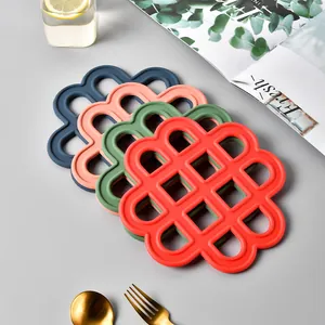 Set of hollow silicone Chinese knot heat insulation pads in various colors for table