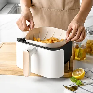 Heat resistant beige silicone air fryer liner with handles for easy cooking and baking