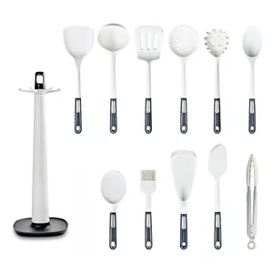 12-Piece white silicone kitchen utensil set with hanging storage rack and ergonomic handles