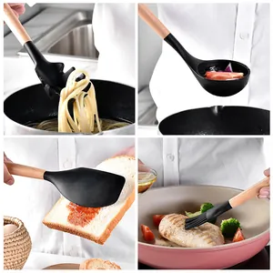 Close-up detail view of black silicone kitchen utensils with wooden handles used for cooking