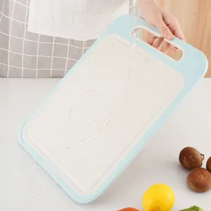 Durable non-slip double-sided cutting board with ergonomic handle for kitchen vegetables