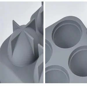 Detailed close-up of gray silicone ice ball mold showing cavities and base structure.