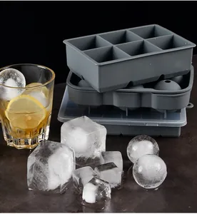 Detail view of silicone ice cube tray set with large square and sphere molds and clear lid