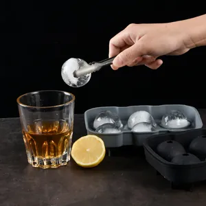 6-hole silicone ice ball mold for whiskey with spherical ice cubes in usage scene