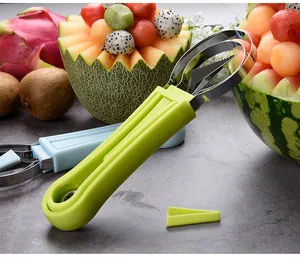 Close-up of fruit carving and ball scooper set with stainless steel blades and green handle