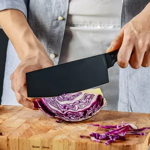 Premium black non-stick stainless steel kitchen cleaver cutting red cabbage on a wooden board