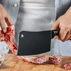 Heavy duty stainless steel black cleaver knife for chopping pork ribs on wooden board
