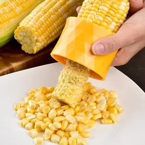 Efficient manual corn stripper tool made of yellow PP material for kitchen use