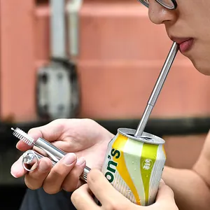 Portable reusable telescopic 304 stainless steel straw with cleaning brush in use