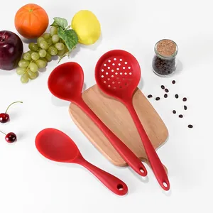Red heat-resistant silicone kitchen utensil set with soup ladle and slotted spoon