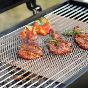 Reusable non-stick fiberglass BBQ grill mesh mat featuring grilled meat and skewers