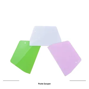 Set of 3 trapezoidal plastic dough scrapers in white green and purple for baking