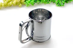 Close-up of a professional stainless steel hand-crank flour sifter with a double layer filter