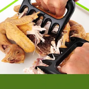 Griffes d'ours noires pour déchiqueter la viande de barbecue et le poulet