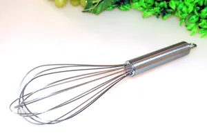 Close-up of a durable stainless steel manual egg whisk showing the sturdy wire loop design
