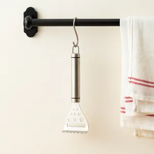 Professional 304 stainless steel cheese scraper butter planer hanging on a kitchen rack