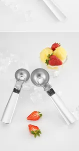 Close-up of two 304 stainless steel ice cream scoops with matte finish and ice cubes