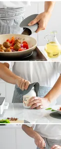 Detail of gray silicone honeycomb heat-resistant mat used as oven mitt and jar opener