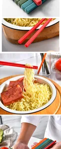 Close-up detail of non-slip silicone chopsticks lifting noodles in a home kitchen setting