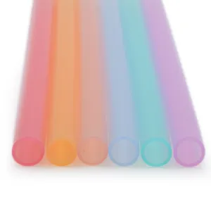 Vibrant multi-colored reusable food-grade silicone straws in a transparent rainbow set