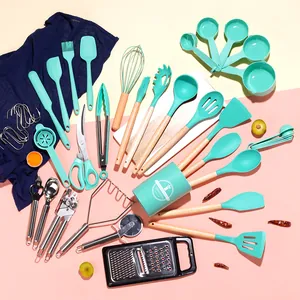 44-piece silicone kitchen utensil set with wooden handles in mint green on pink background