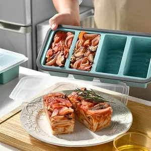 Blue silicone freezing tray for meal prep with 1-cup portion control compartments