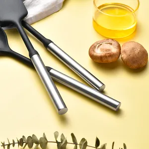 Professional silicone kitchenware set with stainless steel handles in scene.