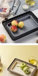 Detailed view of the multi-functional collapsible draining basket and cutting board set.