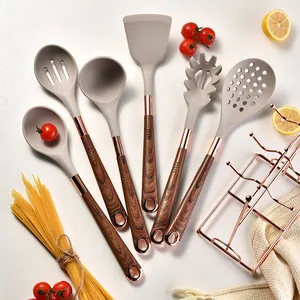 7-piece silicone kitchen utensil set with wood-grain handles and rose gold rack