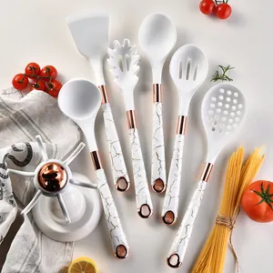 Elegant 7-piece white silicone kitchen utensil set with marble pattern handles and gold rack