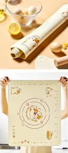 Detail of a thickened silicone pastry mat with cute orange cat and measurement scales for baking.