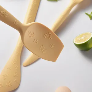 Premium cream silicone baking spatula featuring elegant embossed floral patterns for cake