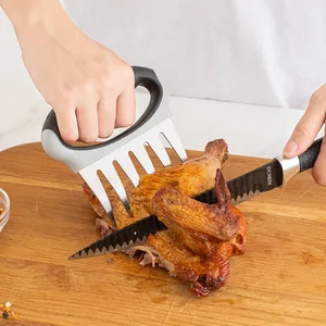 High-quality stainless steel meat shredder claws for BBQ pulling chicken on wooden board