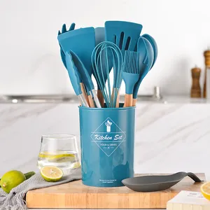Teal 12-piece silicone kitchen utensil set with wooden handles and storage bucket