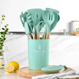 12-piece mint green silicone kitchen utensil set with natural wooden handles and holder
